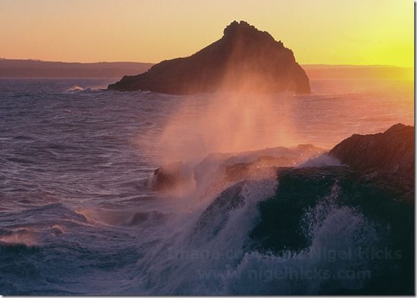 Spray sunlit by a setting winter sun, with Thatcher Rock in the background; Hope Nose, Torbay, Great Britain.,  calendars, How to publish a calendar, How to Publish a Photography Calendar, Higel Hicks Dorcet Light, Somerset Light, Devon Light,