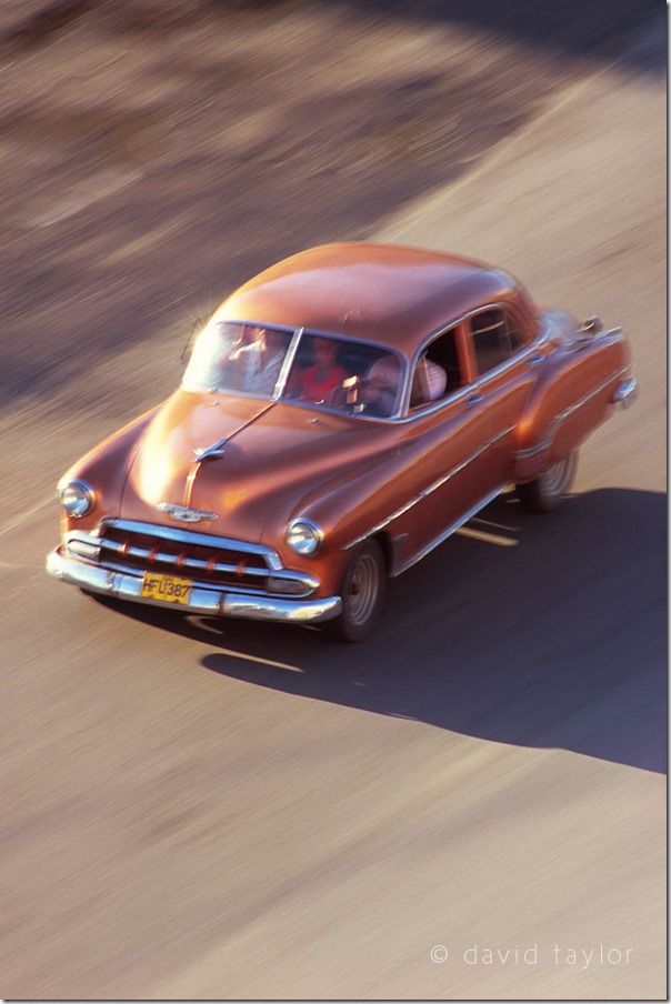 Classic 1950s car zipping through the streets of Havana, Cuba, Shutter Speed, fast Shutter speed, freezing action, Hand held, Camera Shake, Panning, 