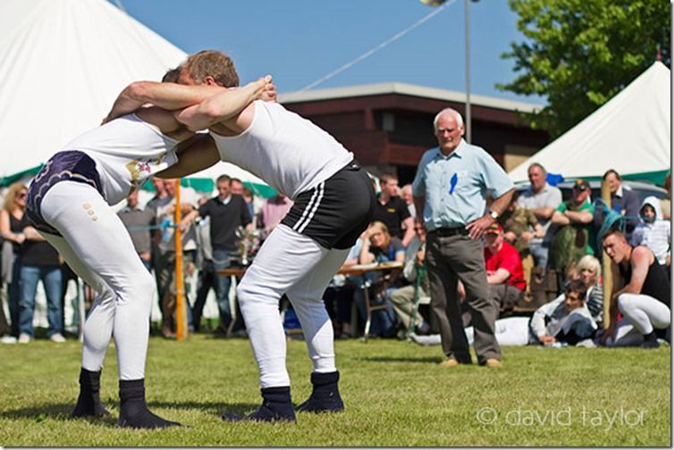 Young men engaged in 'Cumberland Wrestling' at the Northumberland County Show in Corbridge, England