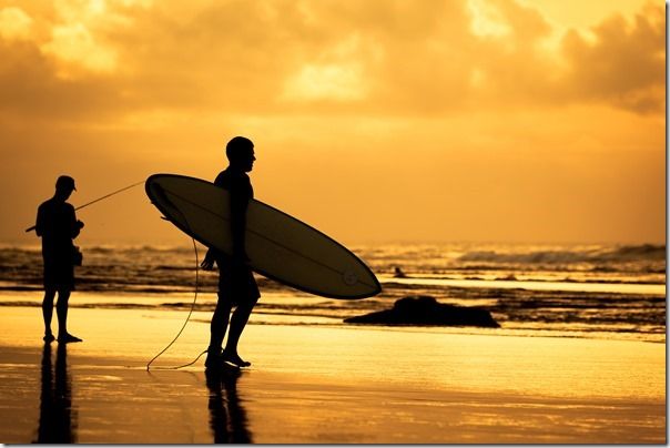 surfer silhouette during sunset