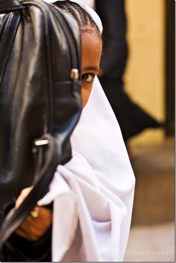 Child playing hide and seek in Stone Town, Zanzibar, Travel Photography, portraits, portraiture, Street Photography, portrait, 