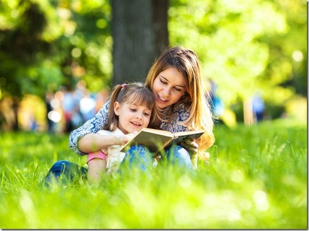 Mother and daughter relaxing in park.