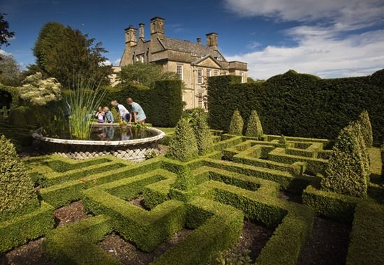 Family at Bourton House Garden, Gloucestershire, UK