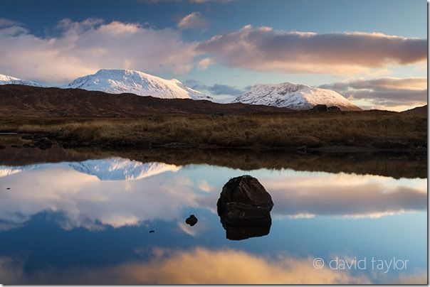 Sunset over Lochan Na Stainge with the Black Mount behind on Rannoch Moor in the Scottish Highland, Argyll & Bute, Scotland