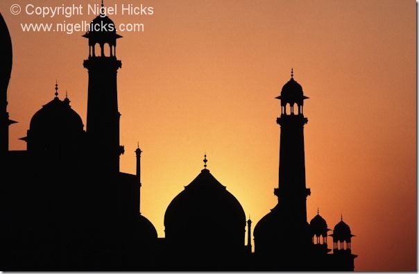 Part of the Taj Mahal silhouetted by the setting sun, Agra, India., sunset, sunsets, exposure, golden hour, camera lens, white balance, sun, light, dusk, 