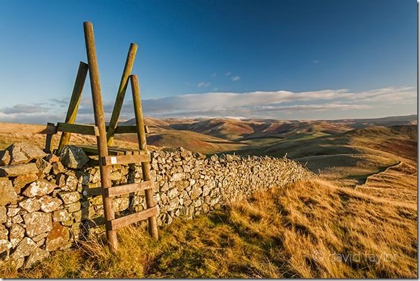 Style over a drystone wall leading to the summit of Wideopen Hill on the St. Cuthbert's Way long distance trail, Scottish Borders, Scotland