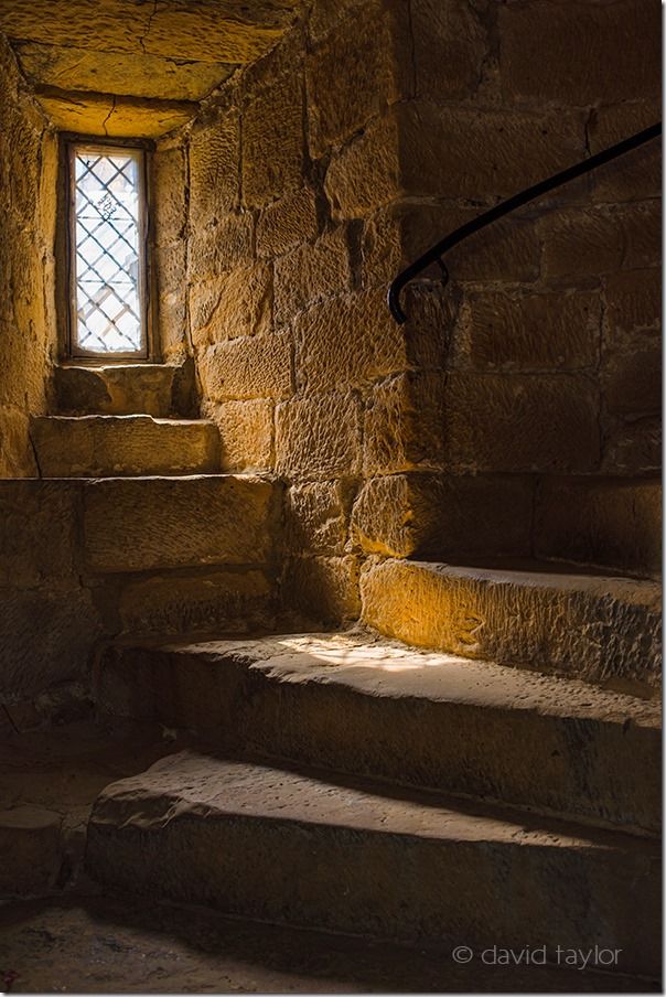 Dimly lit spiral staircase in Belsay Castle, Northumberland