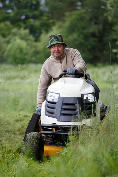 man with lawn mower