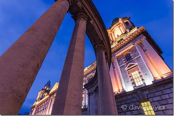 Belfast City Hall framed by the cenotaph memorial on Donegall Square West, Northern Ireland