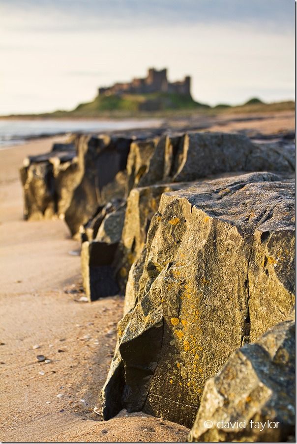 Rock shelf on Bambugh beach pointing toward Bamburgh Castle on the Northumberland coast, England, Restricting depth of field, depth of field, DOF, small depth of field, free monthly photography competition, Online Photography Courses, focusing