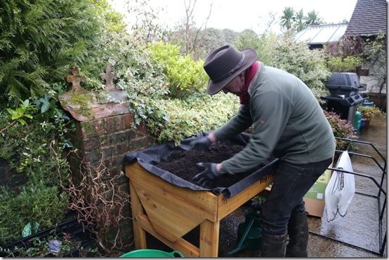 Breaking up and firming compost