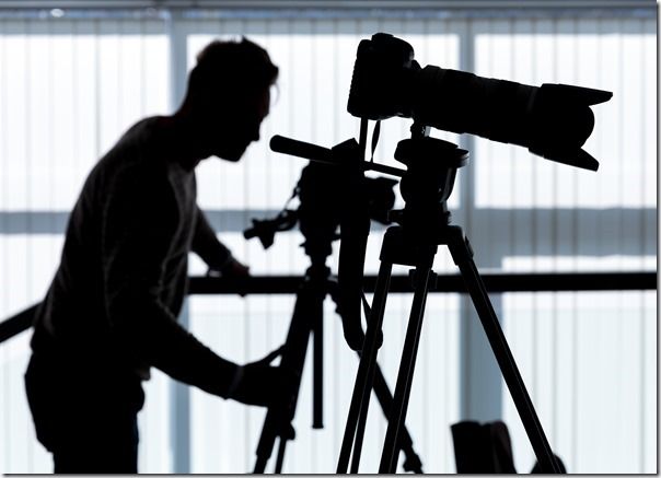 Silhouette of photographer and cameraman