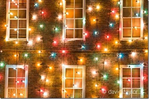 A Georgian building in Market Place, Morpeth, lit by multi-coloured Christmas lights, Northumberland, England. Morpeth is an ancient market town located on the River Wansbeck