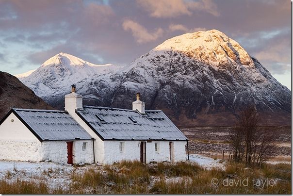 Blackrock Cottage at the foot of Meall a’ Bhuird, Rannoch Moor with Buachaille Etive Mor (Stob Bearg) behind, Scottish Highlands, Scotland