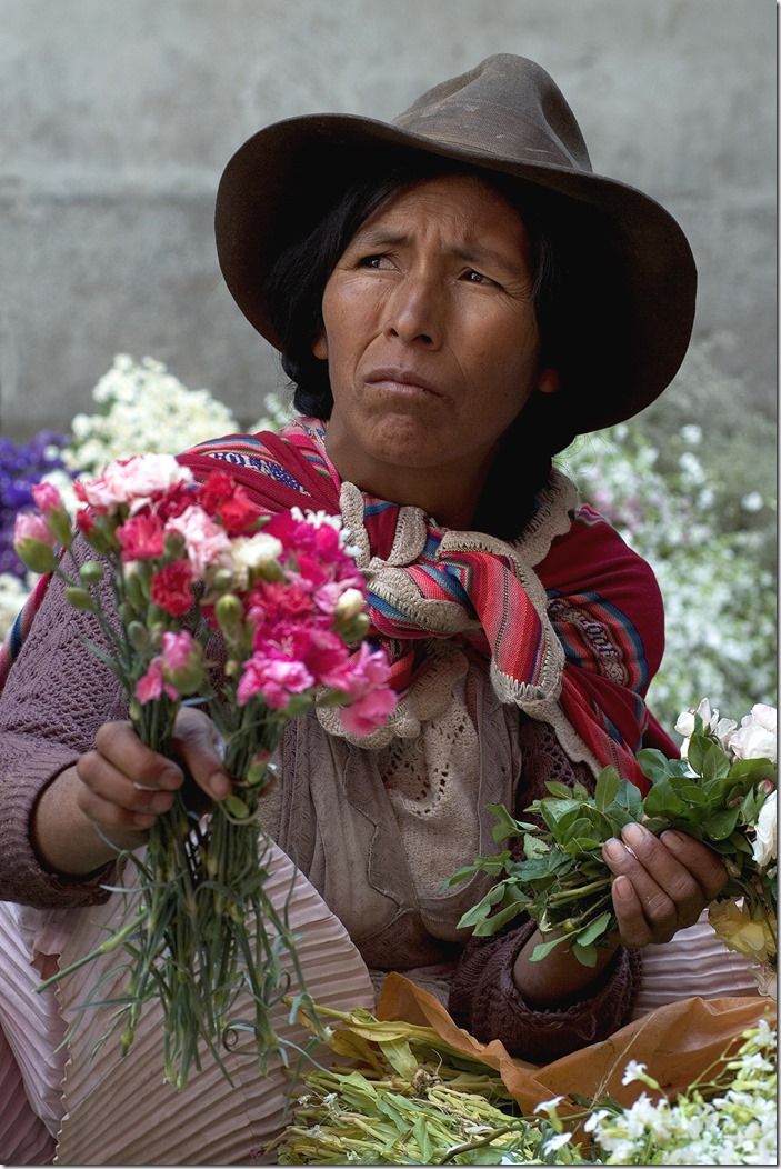 Bolivian woman selling flowers on the market of Sucre. South America