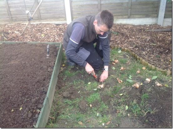 Jamie planting bulbsinwildlifemeadow