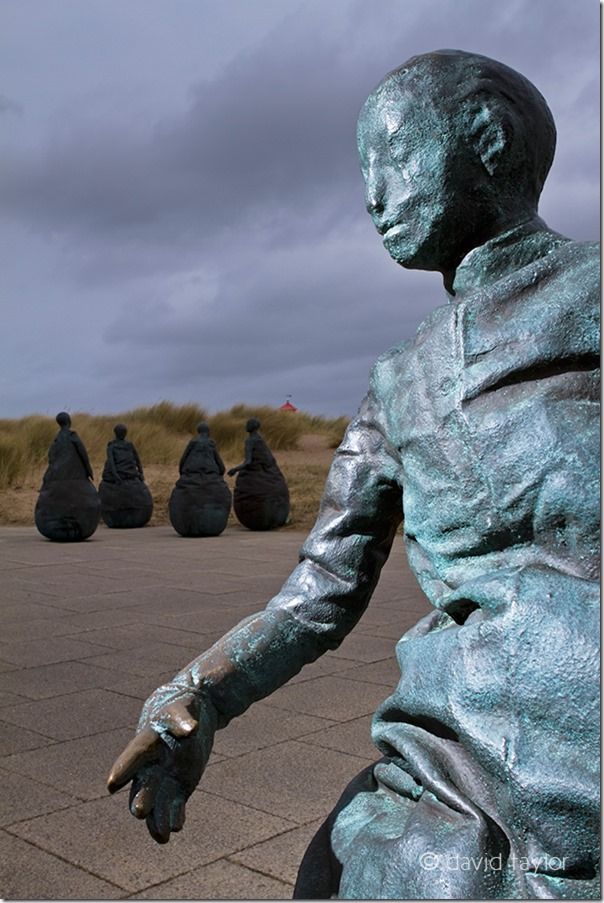 Figures from the 'Conversation Piece' by the Spanish sculptor Juan Munoz at Littlehaven in South Shields, South Tyneside, England