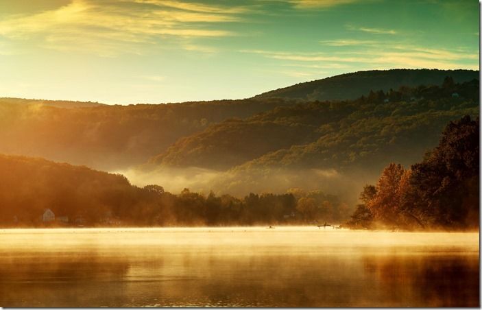 Beautiful autumn landscape, the lake in the morning fog